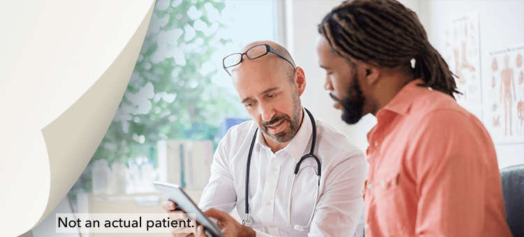 Two professionals using a tablet to discuss ordering and reimbursement options for DEFINITY®, enhancing operational efficiency